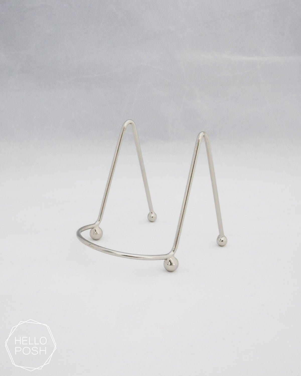 Small silver easels; metal display stands